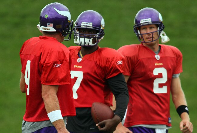 EDEN PRAIRIE, MN - AUGUST 18: Quarterbacks Brett Favre #4, Tarvaris Jackson #7 and Sage Rosenfels #2 of the Minnesota Vikings participate in Favre's first morning practice since returning to Vikings Winter Park on August 18, 2010 in Eden Prairie, Minnesota. Favre injured his ankle last year and had been reportedly considering retiring after one season with the Vikings.  (Photo by Adam Bettcher/Getty Images)