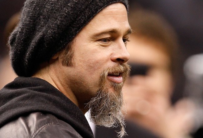 NEW ORLEANS - JANUARY 16:  Actor Brad Pitt stands on the sidelines during warm ups prior to the New Orleans Saints hosting the Arizona Cardinals during the NFC Divisional Playoff Game at Louisana Superdome on January 16, 2010 in New Orleans, Louisiana.  (Photo by Ronald Martinez/Getty Images)