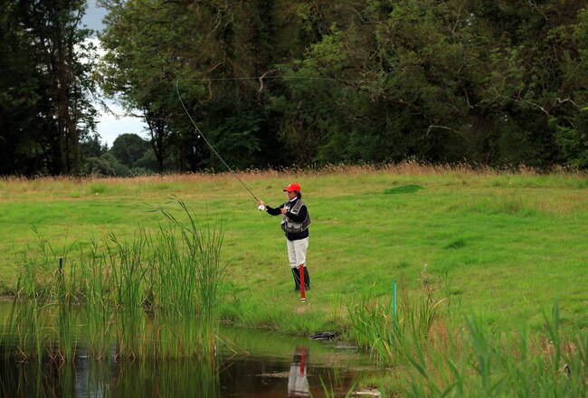 DUNSANY, CO MEATH - AUGUST 03:  Rosie Jones of the USA the US Team Captain competing hard in the fly fishing challenge after the captain's photocall as a preview for the 2011 Solheim Cup at Killeen Castle on August 3, 2010 in Dunsany, Co Meath, Ireland.  (Photo by David Cannon/Getty Images)