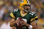 GREEN BAY, WI - AUGUST 26: Aaron Rodgers #12 of the Green Bay Packers looks for a receiver against the Indianapolis Colts during a preseason game at Lambeau Field on August 26, 2010 in Green Bay, Wisconsin. The Packers defeated the Colts 59-24.  (Photo by Jonathan Daniel/Getty Images)