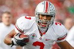 PASADENA, CA - JANUARY 01:  Running back Brandon Saine #3 of the Ohio State Buckeyes runs with the ball against the Oregon Ducks during the 96th Rose Bowl game on January 1, 2010 in Pasadena, California.  (Photo by Jeff Gross/Getty Images)