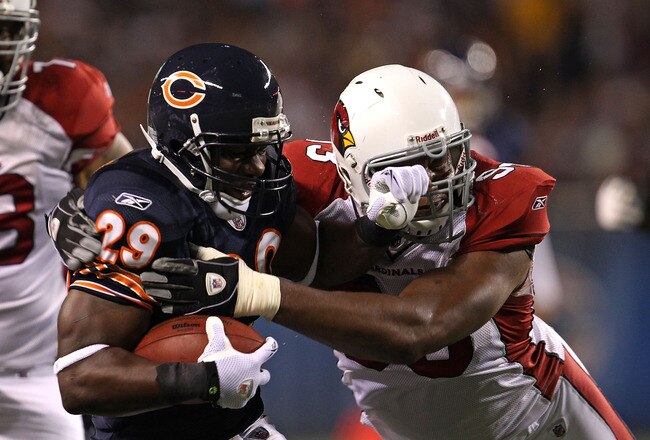 CHICAGO - AUGUST 28: Chester Taylor #29 of the Chicago Bears is hit by Calais Campbell #93 of the Arizona Cardinals during a preseason game at Soldier Field on August 28, 2010 in Chicago, Illinois. The Cardinals defeated the Bears 14-9. (Photo by Jonathan Daniel/Getty Images)