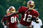 ASHBURN, VA - JULY 30:  Washington Redskins wide receiver Malcom Kelly (#12) catches a pass during drills on opening day of training camp July 30, 2009 in Ashburn, Virginia.  (Photo by Win McNamee/Getty Images)