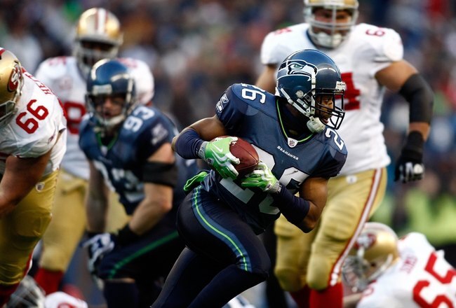 SEATTLE , WA - DECEMBER 06:  Josh Wilson #26 of the Seattle Seahawks runs with the ball after recovering a fumble against the San Francisco 49ers at Qwest Field on December 6, 2009 in Seattle, Washington.  (Photo by Jonathan Ferrey/Getty Images)