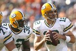 CLEVELAND, OH - OCTOBER 25:  Aaron Rodgers #12 of the Green Bay Packers drops back to pass as he gets protection from Brandon Jackson #32 and Josh Sitton #71 against the Cleveland Browns at Cleveland Browns Stadium on October 25, 2009 in Cleveland, Ohio.  (Photo by Matt Sullivan/Getty Images)