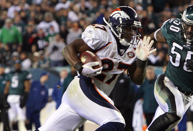 PHILADELPHIA - DECEMBER 27:  Knowshon Moreno #27 of the Denver Broncos runs the ball past Will Witherspoon #50 of the Philadelphia Eagles for a touchdown on December 27, 2009 at Lincoln Financial Field in Philadelphia, Pennsylvania. The Eagles defeated the Broncos 30-27.  (Photo by Jim McIsaac/Getty Images)