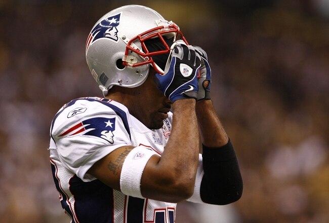 NEW ORLEANS - NOVEMBER 30: Leigh Bodden #23 of the New England Patriots clutches his facemask as he reacts after Marques Colston #12 of the New Orleans Saints scored on a 20-yard touchdown reception in the fourth quarter at Louisana Superdome on November 30, 2009 in New Orleans, Louisiana. (Photo by Scott Halleran/Getty Images)