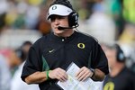PASADENA, CA - JANUARY 01:  Head coach Chip Kelly of the Oregon Ducks stands on the sidelines during the game against the Ohio State Buckeyes at the 96th Rose Bowl game on January 1, 2010 in Pasadena, California.  (Photo by Kevork Djansezian/Getty Images)