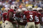 JACKSONVILLE, FL - JANUARY 01:  Quarterback E.J. Manuel #3 of the Florida State Seminoles calls out a play in the huddle against the West Virginia Mountaineers during the Konica Minolta Gator Bowl on January 1, 2010 at Jacksonville Municipal Stadium in Jacksonville, Florida. Florida State defeated West Virginia 33-21 in Bobby Bowden's last game as a head coach for the Seminoles.  (Photo by Doug Benc/Getty Images)