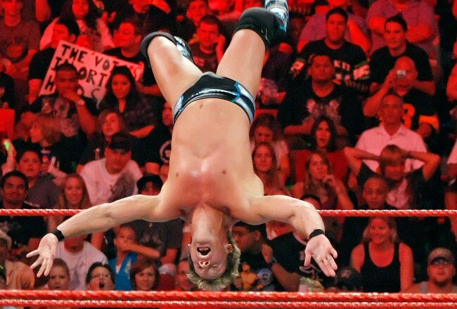 LAS VEGAS - AUGUST 24:  Wrestler Chris Jericho jumps off the ropes at wrestler MVP during the WWE Monday Night Raw show at the Thomas & Mack Center August 24, 2009 in Las Vegas, Nevada.  (Photo by Ethan Miller/Getty Images)