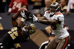 NEW ORLEANS - DECEMBER 27:  Cornerback Tracy Porter #22 of the New Orleans Saints intercepts a pass in the end-zone intended for Antonio Bryant #89 of the Tampa Bay Buccaneers during the game on December 27, 2009 at Louisiana Superdome in New Orleans, Louisiana.  (Photo by Jamie Squire/Getty Images)