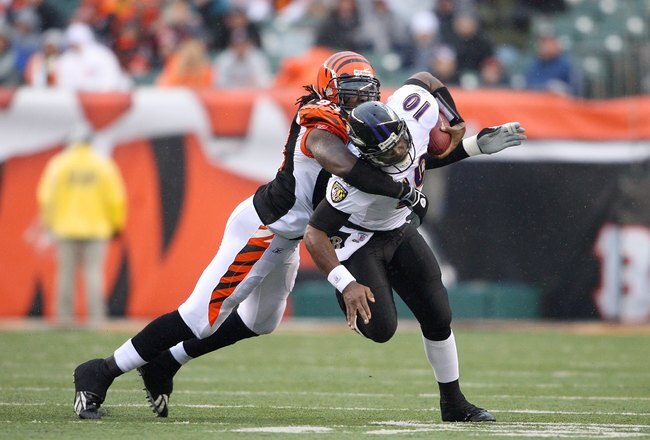 CINCINNATI - NOVEMBER 30:  Rashad Jeany #93 of the Cincinnati Bengals tackles quarterback Troy Smith #16 of the Baltimore Raven during their NFL game on November 30, 2008 at Paul Brown Stadium in Cincinnati, Ohio. The Ravens defeated the Bengals 34-3.(Photo by Andy Lyons/Getty Images)