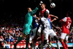 BLACKBURN, ENGLAND - AUGUST 28:  Manuel Almunia of Arsenal punches clear under pressure from Chris Samba of Blackburn Rovers during the Barclays Premier League match between Blackburn Rovers and Arsenal at Ewood Park on August 28, 2010 in Blackburn, England.  (Photo by Alex Livesey/Getty Images)