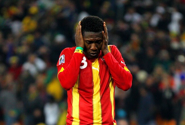 JOHANNESBURG, SOUTH AFRICA - JULY 02:  Asamoah Gyan of Ghana looks dejected after missing his penalty during the 2010 FIFA World Cup South Africa Quarter Final match between Uruguay and Ghana at the Soccer City stadium on July 2, 2010 in Johannesburg, South Africa.  (Photo by Cameron Spencer/Getty Images)