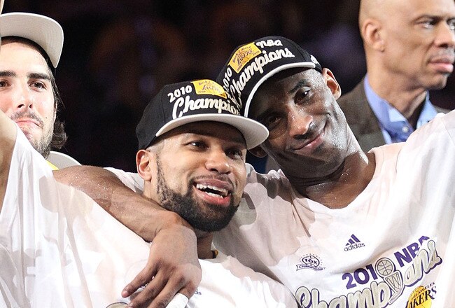 LOS ANGELES, CA - JUNE 17:  Derek Fisher #2 and Kobe Bryant #24 of the Los Angeles Lakers celebrate after the Lakers defeated the Boston Celtics 83-79 in Game Seven of the 2010 NBA Finals at Staples Center on June 17, 2010 in Los Angeles, California.  NOTE TO USER: User expressly acknowledges and agrees that, by downloading and/or using this Photograph, user is consenting to the terms and conditions of the Getty Images License Agreement.  (Photo by Ronald Martinez/Getty Images)