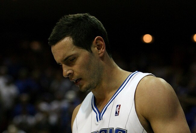 ORLANDO, FL - MAY 16:  J.J. Redick #7 of the Orlando Magic walks on the court with his head down late in the fourth quarter against the Boston Celtics in Game One of the Eastern Conference Finals during the 2010 NBA Playoffs at Amway Arena on May 16, 2010 in Orlando, Florida.  NOTE TO USER: User expressly acknowledges and agrees that, by downloading and/or using this Photograph, user is consenting to the terms and conditions of the Getty Images License Agreement.  (Photo by Doug Benc/Getty Images)