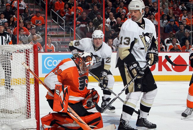PHILADELPHIA - JANUARY 24:  Ray Emery #29 of the Philadelphia Flyers makes a save under pressure from Bill Guerin #13 and Ruslan Fedotenko #26 on January 24, 2010 at Wachovia Center in Philadelphia, Pennsylvania.  (Photo by Jim McIsaac/Getty Images)