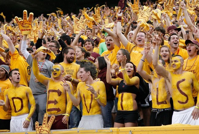TEMPE, AZ - NOVEMBER 28:  Fans of the Arizona State Sun Devils cheer during the college football game against the Arizona Wildcats at Sun Devil Stadium on November 28, 2009 in Tempe, Arizona.  The Wildcats defeated the Sun Devils 20-17.  (Photo by Christian Petersen/Getty Images)