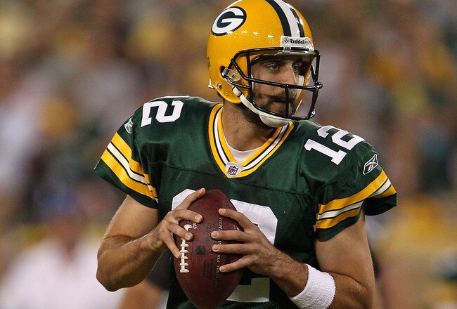 GREEN BAY, WI - AUGUST 26: Aaron Rodgers #12 of the Green Bay Packers looks for a receiver against the Indianapolis Colts during a preseason game at Lambeau Field on August 26, 2010 in Green Bay, Wisconsin. The Packers defeated the Colts 59-24.  (Photo by Jonathan Daniel/Getty Images)