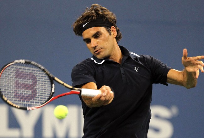 NEW YORK - AUGUST 30:  Roger Federer of Switzerland returns a forehand against Brian Dabul of Argentina during the Men's Singles first round match on day one of the 2010 U.S. Open at the USTA Billie Jean King National Tennis Center on August 30, 2010 in the Flushing neighborhood of the Queens borough of New York City.  (Photo by Al Bello/Getty Images)