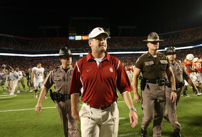 FORT LAUDERDALE, FL - OCTOBER 03: Head coach Bob Stoops of the Oklahoma Sooners walks off the field after his team lost to the Miami Hurricanes at Land Shark Stadium on October 3, 2009 in Fort Lauderdale, Florida. Miami defeated Oklahoma 21-20. (Photo by Doug Benc/Getty Images)