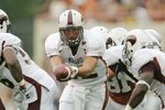 AUSTIN, TX - SEPTEMBER 5:  Quarterback Trey Revell #12 of the Louisiana Monroe Warhawks looks to hand off the ball to a running back during their game against the Texas Longhorns on September 5, 2009 at Darrell K Royal-Texas Memorial Stadium in Austin, Texas. The Longhorns defeated the Warhawks 59-20. (Photo by Brian Bahr/Getty Images)