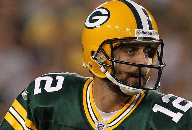GREEN BAY, WI - AUGUST 26: Aaron Rodgers #12 of the Green Bay Packers looks for a receiver against the Indianapolis Colts during a preseason game at Lambeau Field on August 26, 2010 in Green Bay, Wisconsin. The Packers defeated the Colts 59-24.  (Photo by Jonathan Daniel/Getty Images)