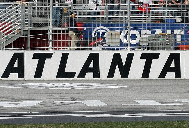 ATLANTA - MARCH 07:  Kurt Busch, driver of the #2 Miller Lite Dodge, crosses the finish line to win the NASCAR Sprint Cup Series Kobalt Tools 500 at Atlanta Motor Speedway on March 7, 2010 in Hampton, Georgia.  (Photo by Tom Whitmore/Getty Images for NASCAR)