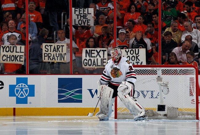 PHILADELPHIA - JUNE 09:  Antti Niemi #31 of the Chicago Blackhawks minds the net as fans of the Philadelphia Flyers hold up signs behind him in Game Six of the 2010 NHL Stanley Cup Final at the Wachovia Center on June 9, 2010 in Philadelphia, Pennsylvania.  (Photo by Bruce Bennett/Getty Images)