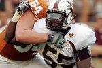 AUSTIN, TX - SEPTEMBER 5:  Defensive end Troy Evans #55 of the Louisiana Monroe Warhawks rushes the quarterback against outside tackle Kyle Hix #64 of the Texas Longhorns on September 5, 2009 at Darrell K Royal-Texas Memorial Stadium in Austin, Texas. The Longhorns defeated the Warhawks 59-20. (Photo by Brian Bahr/Getty Images)