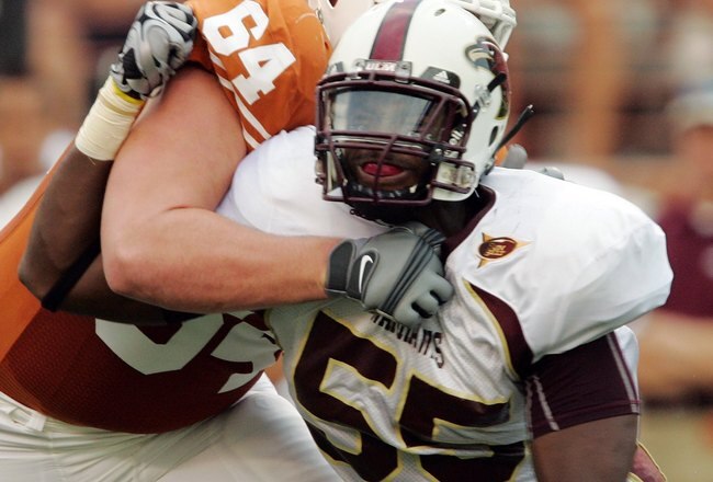 AUSTIN, TX - SEPTEMBER 5:  Defensive end Troy Evans #55 of the Louisiana Monroe Warhawks rushes the quarterback against outside tackle Kyle Hix #64 of the Texas Longhorns on September 5, 2009 at Darrell K Royal-Texas Memorial Stadium in Austin, Texas. The Longhorns defeated the Warhawks 59-20. (Photo by Brian Bahr/Getty Images)