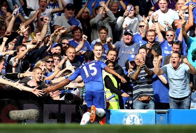 LONDON, ENGLAND - AUGUST 28:  Florent Malouda of Chelsea celebrates with the fans after scoring the opening goal during the Barclays Premier League match between Chelsea and Stoke City at Stamford Bridge on August 28, 2010 in London, England.  (Photo by Bryn Lennon/Getty Images)