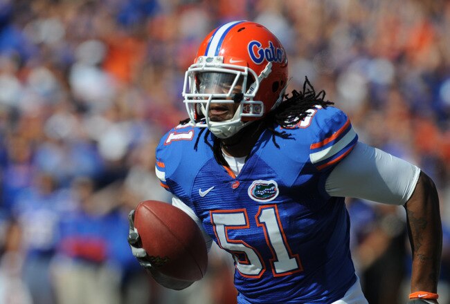 GAINESVILLE, FL - NOVEMBER 21: Linebacker Brandon Spikes #51 of the Florida Gators returns an interception 40 yards for a first-quarter touchdown against the Florida International University Golden Panthers, November 21, 2009 at Ben Hill Griffin Stadium in Gainesville, Florida.  (Photo by Al Messerschmidt/Getty Images)