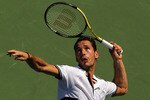 NEW YORK - SEPTEMBER 01:  Michael Llodra of France serves against Tomas Berdych of the Czech Republic during his first round men's singles match on during day three of the 2010 U.S. Open at the USTA Billie Jean King National Tennis Center on September 1, 2010 in the Flushing neighborhood of the Queens borough of New York City.  (Photo by Al Bello/Getty Images)