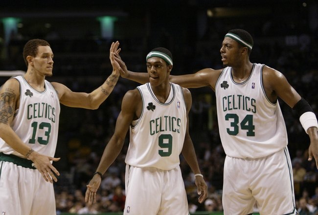 BOSTON - NOVEMBER 15:  Rajon Rondo #9 of the Boston Celtics looks on as Delonte West #13 and Paul Pierce #34 celebrate against the Indiana Pacers on November 15, 2006 at the TD Banknorth Garden in Boston, Massachusetts. The Celtics defeated the Pacers 114-88. NOTE TO USER: User expressly acknowledges and agrees that, by downloading and or using this photograph, User is consenting to the terms and conditions of the Getty Images License Agreement. (Photo by Elsa/Getty Images)