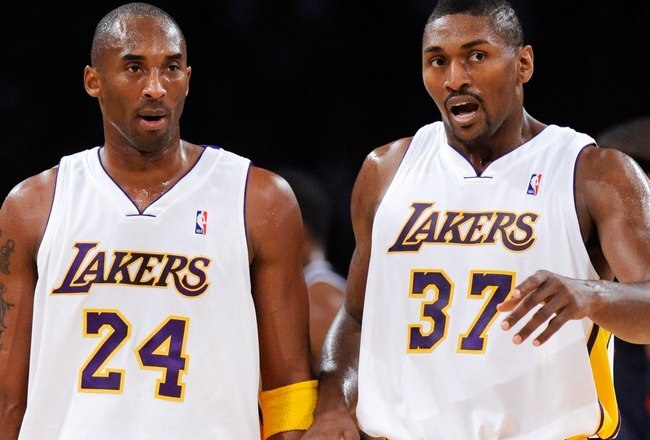LOS ANGELES, CA - NOVEMBER 01:  Kobe Bryant #24 and Ron Artest of the Los Angeles Lakers talk against the Atlanta Hawks during the second quarter of the NBA basketball game at Staples Center on November 1, 2009 in Los Angeles, California. Bryant scored 41 points and the Lakers went on to win 118-110. NOTE TO USER: User expressly acknowledges and agrees that, by downloading and/or using this Photograph, user is consenting to the terms and conditions of the Getty Images License Agreement.  (Photo by Kevork Djansezian/Getty Images)