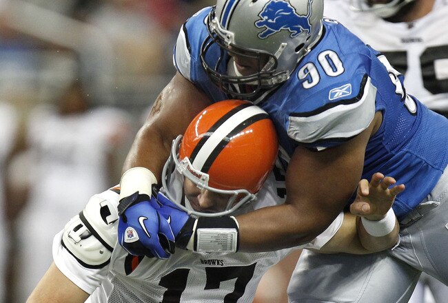 DETROIT - AUGUST 28:  Ndamukong Suh #90 of the Detroit Lions tackles Jake Delhomme #17 of the Cleveland Browns during a preseason game on August 28, 2010 at Ford Field in Detroit, Michigan. Suh was called for a personal foul on the play for grabbing the face mask. (Photo by Gregory Shamus/Getty Images)
