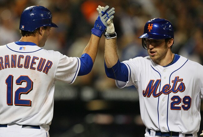 NEW YORK - APRIL 23:  Ike Davis #29 of the New York Mets is greeted by Jeff Francouer #12 after hitting his first major league home run in the fifth inning  against the Atlanta Braves on April 23, 2010 at Citi Field in the Flushing neighborhood of the Queens borough of New York City.  (Photo by Mike Stobe/Getty Images)