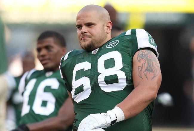 EAST RUTHERFORD, NJ - AUGUST 14:  Matt Slauson #68 of the New York Jets  warms up against the St. Louis Rams during their preseason game at Giants Stadium on August 14, 2009  in East Rutherford, New Jersey.  (Photo by Nick Laham/Getty Images)