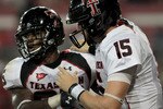 HOUSTON - SEPTEMBER 26: Quarterback Taylor Potts #15 congratulates running back Baron Batch #25 of the Texas Tech Red Raiders for scoring a touchdown against the Houston Cougars at Robertson Stadium on September 26, 2009 in Houston, Texas.  (Photo by Thomas B. Shea/Getty Images)