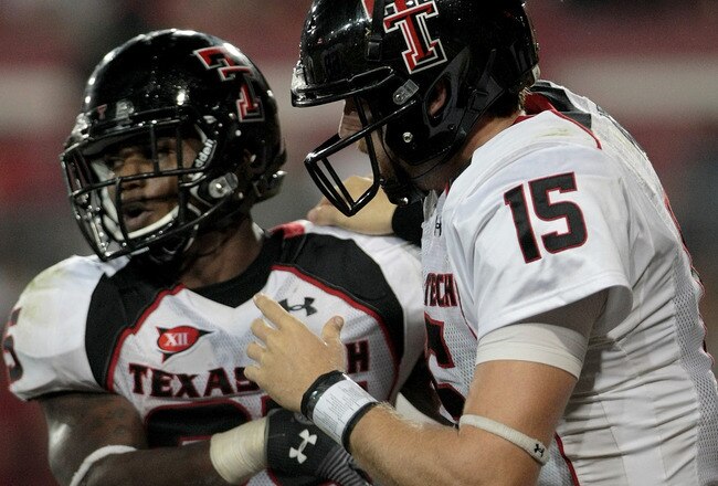 HOUSTON - SEPTEMBER 26: Quarterback Taylor Potts #15 congratulates running back Baron Batch #25 of the Texas Tech Red Raiders for scoring a touchdown against the Houston Cougars at Robertson Stadium on September 26, 2009 in Houston, Texas.  (Photo by Thomas B. Shea/Getty Images)