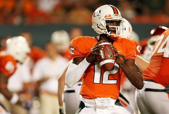 MIAMI GARDENS, FL - OCTOBER 03:  Quarterback Jacory Harris #12 of the Miami Hurricanes drops back to pass against the Oklahoma Sooners at Land Shark Stadium on October 3, 2009 in Miami Gardens, Florida. Miami defeated Oklahoma 21-20.  (Photo by Doug Benc/Getty Images)