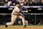 DENVER - APRIL 10:  Second baseman David Eckstein #22 of the San Diego Padres bunts against the Colorado Rockies during MLB action at Coors Field on April 10, 2010 in Denver, Colorado. The Padres defeated the Rockies 5-4 in 14 innings.  (Photo by Doug Pensinger/Getty Images)