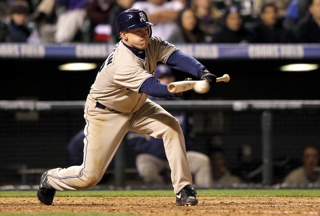 DENVER - APRIL 10:  Second baseman David Eckstein #22 of the San Diego Padres bunts against the Colorado Rockies during MLB action at Coors Field on April 10, 2010 in Denver, Colorado. The Padres defeated the Rockies 5-4 in 14 innings.  (Photo by Doug Pensinger/Getty Images)
