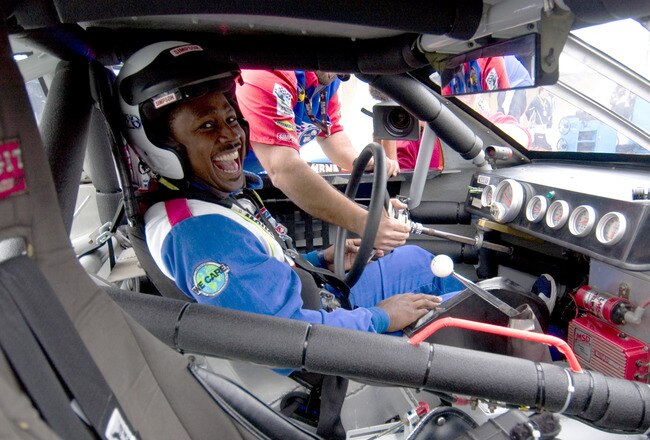 DAYTONA, FL - FEBRUARY 2:  Former NFL player Desmond Howard gets settled into his car during the Richard Petty Driving Experience on February 2, 2005 at the Daytona International Speedway in Daytona, Florida.  (Photo by Matt Stroshane/Getty Images for NASCAR)
