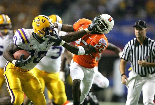 ATLANTA - DECEMBER 30:  Running back Joseph Addai  #10 of the LSU Tigers runs against the defense of Kelly Jennings  #22 of the Miami Hurricanes during 3rd quarter of the Chick-fil-A Peach Bowl on December 30, 2005 at the Georgia Dome in Atlanta, Georgia.  (Photo by Streeter Lecka/Getty Images)