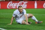 RUSTENBURG, SOUTH AFRICA - JUNE 12:  Wayne Rooney of England picks himself up during the 2010 FIFA World Cup South Africa Group C match between England and USA at the Royal Bafokeng Stadium on June 12, 2010 in Rustenburg, South Africa.  (Photo by Michael Regan/Getty Images)