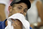 NEW YORK - SEPTEMBER 01:  Andy Roddick of the United States wipes his face during a break point in his second round men's singles match against Janko Tipsarevic of Serbia during on day three of the 2010 U.S. Open at the USTA Billie Jean King National Tennis Center on September 1, 2010 in the Flushing neighborhood of the Queens borough of New York City.  (Photo by Al Bello/Getty Images)