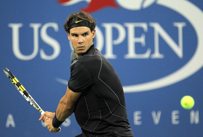 NEW YORK - AUGUST 31:  Rafael Nadal of Spain returns a shot against Teymuraz Gabashvili of Russia during his first round men's single's match on day two of the 2010 U.S. Open at the USTA Billie Jean King National Tennis Center on August 31, 2010 in the Flushing neighborhood of the Queens borough of New York City.  (Photo by Chris McGrath/Getty Images)
