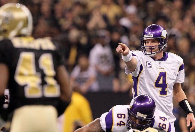 NEW ORLEANS - JANUARY 24:  Brett Favre #4 of the Minnesota Vikings gestures as he calls out signals in the shotgun formation against the New Orleans Saints during the NFC Championship Game at the Louisiana Superdome on January 24, 2010 in New Orleans, Louisiana. THe Saints won 31-28 in overtime. (Photo by Jed Jacobsohn/Getty Images)